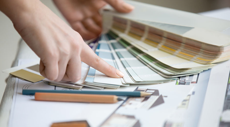 Person selecting paint colors