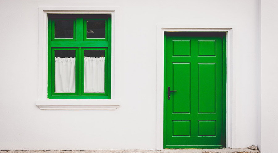 Green window and door on white wall